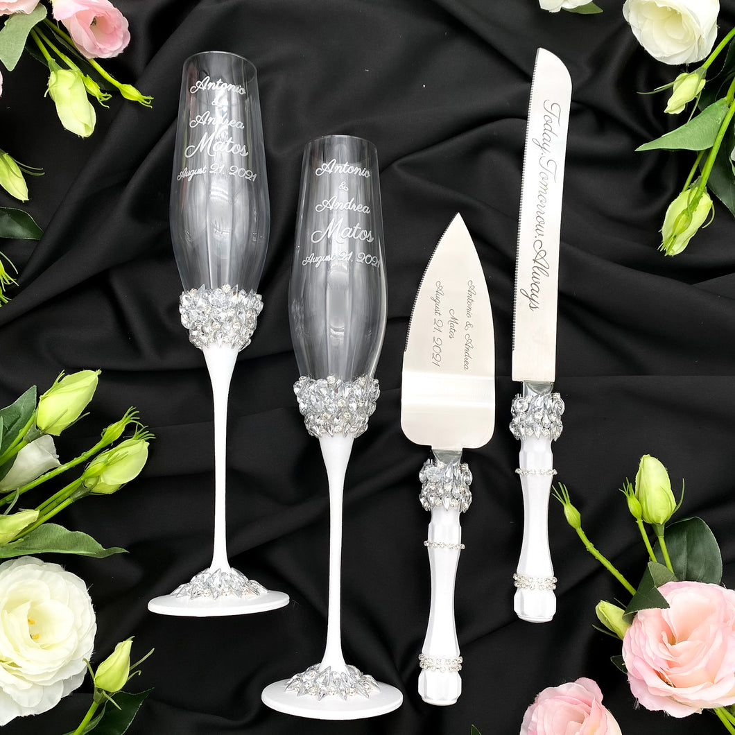 White wedding glasses for bride and groom, cake knife and server