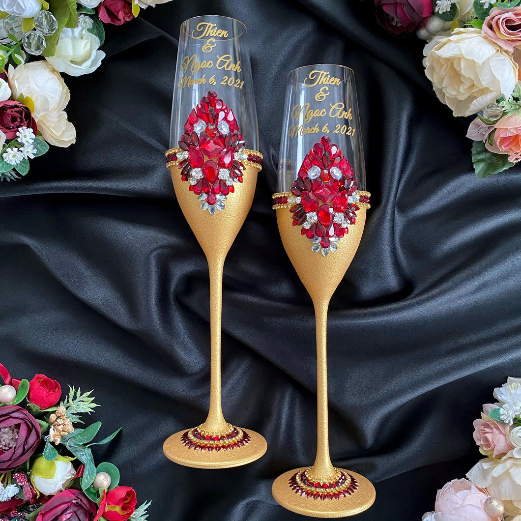 Gold red wedding glasses for bride and groom