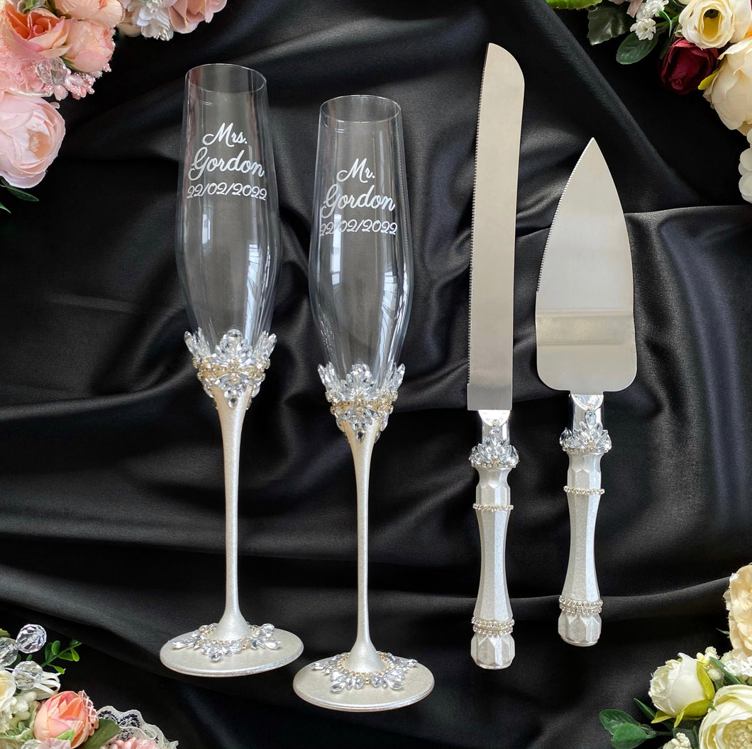 Silver wedding glasses for bride and groom, cake knife and server