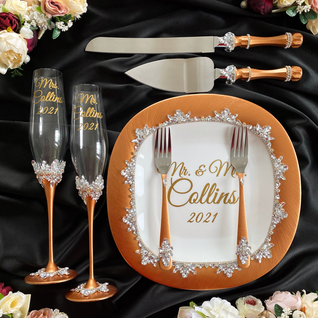 Bronze wedding glasses for bride and groom, cake knife and server, wedding plate and forks