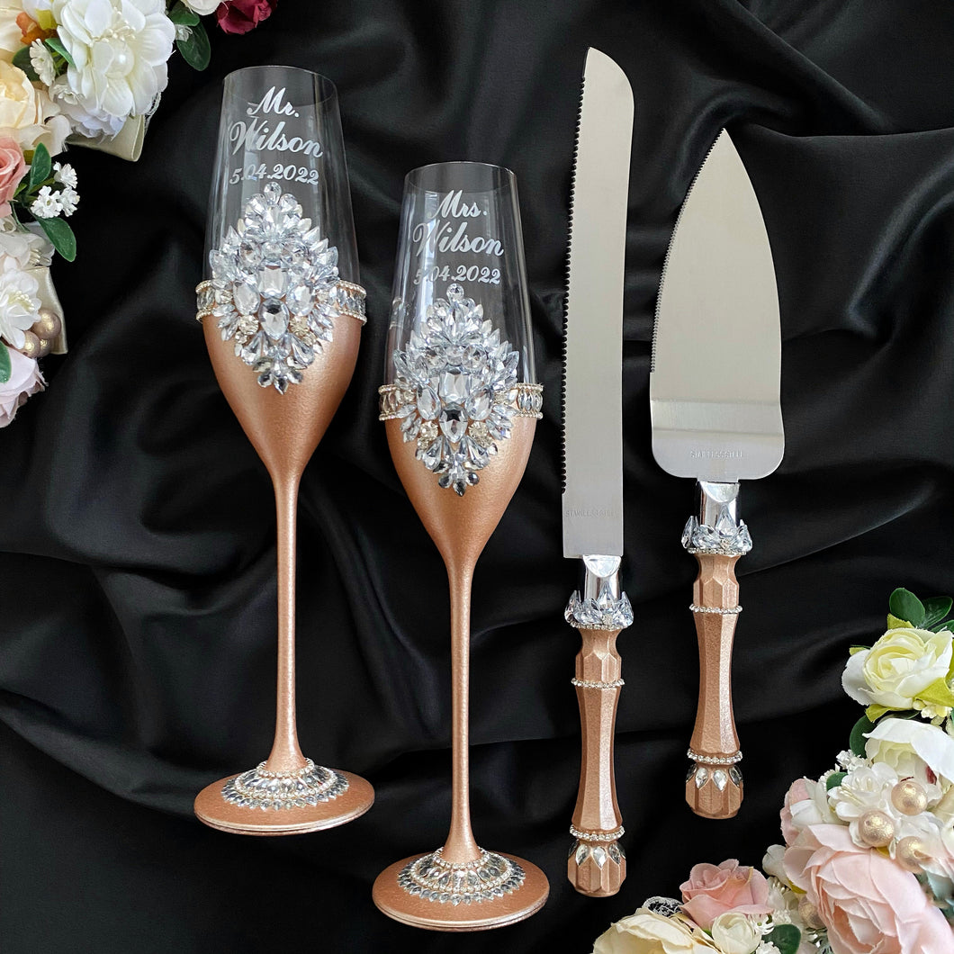 Beige wedding flutes for bride and groom, cake knife and server