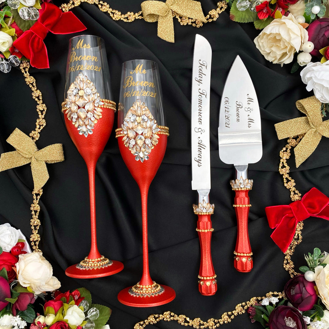 Red wedding glasses for bride and groom, cake knife and server