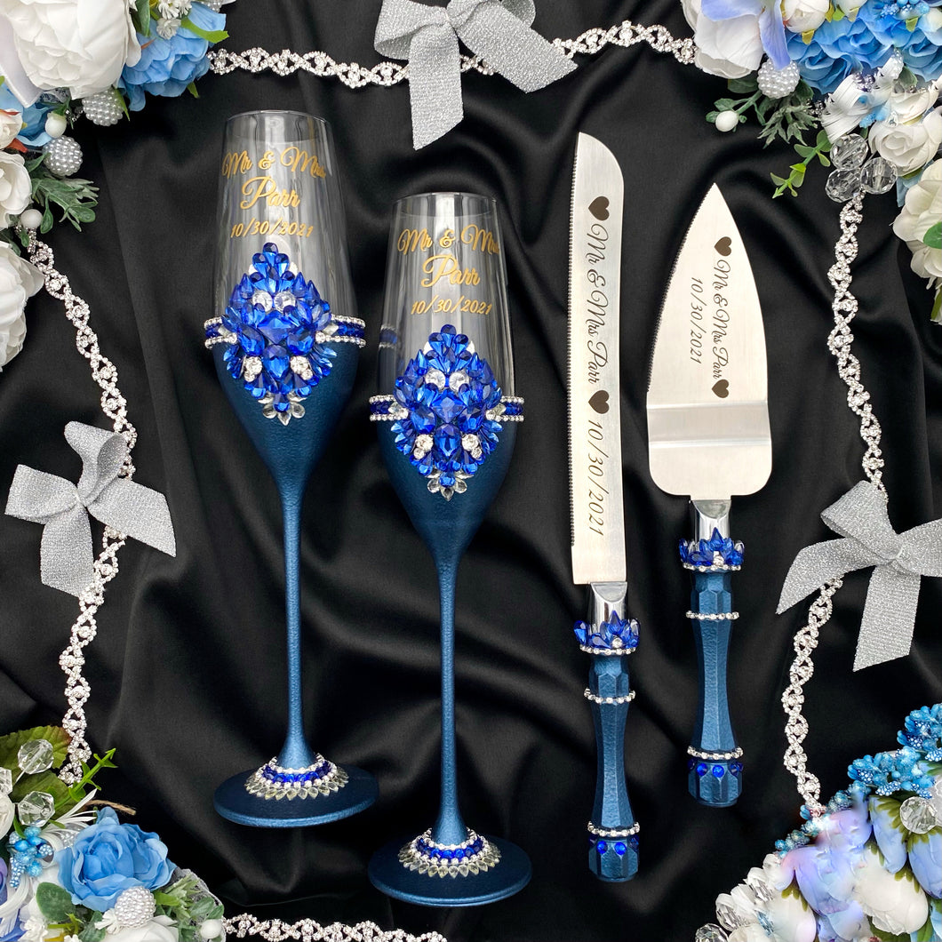 Royal blue wedding glasses for bride and groom, cake knife and server