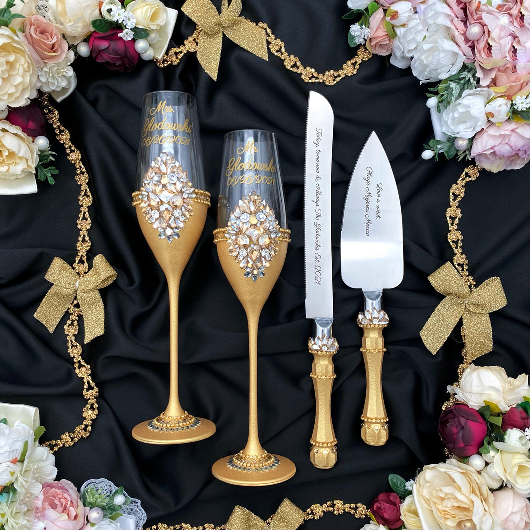 Gold wedding glasses for bride and groom, cake knife and server